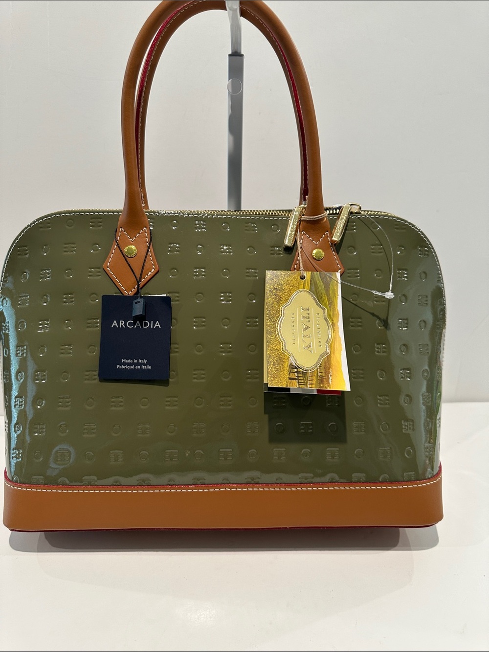 NWT Arcadia Olive/Tan Patent Leather Handbag with Goldtone Hardware Footers.